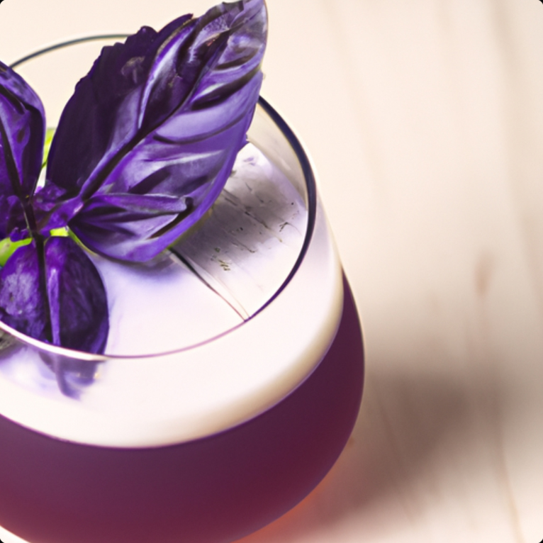 Purple Basil Gin Fizz cocktail with a frothy top, garnished with vibrant purple basil leaves in a glass.